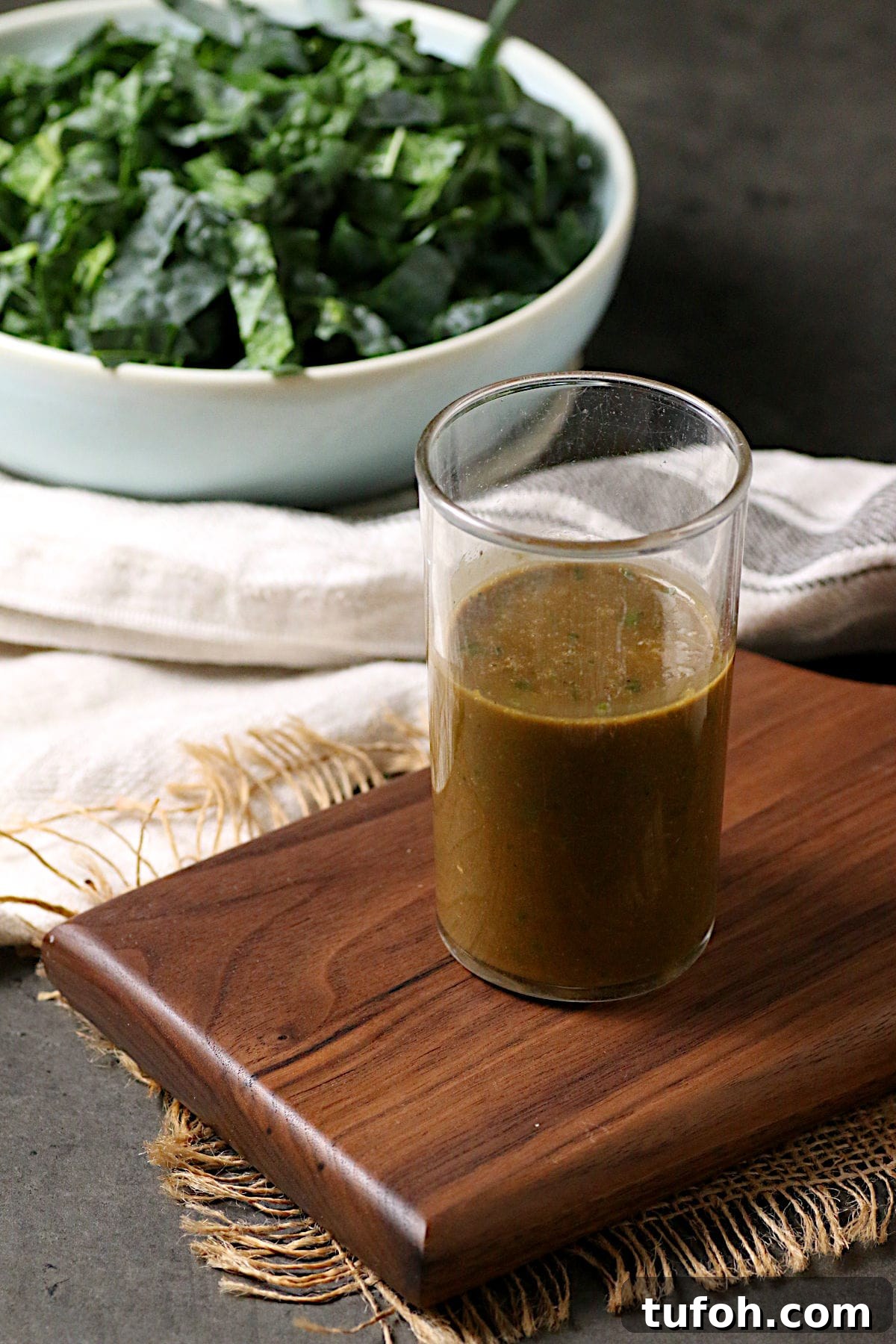 A glass jar of Basil Balsamic Vinaigrette.