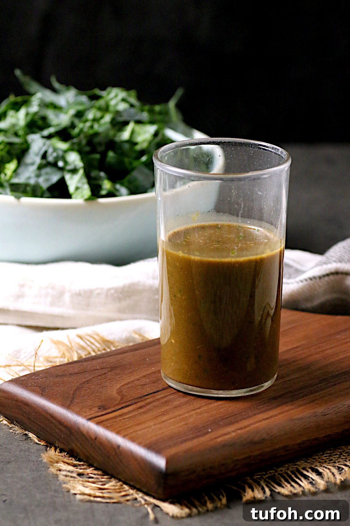 A glass jar of Basil Balsamic Vinaigrette.