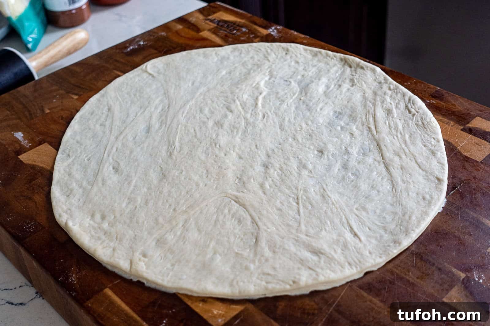 Traeger-Smoked Tri-Tip Pizza Recipe 6 Stretched pizza dough on parchment