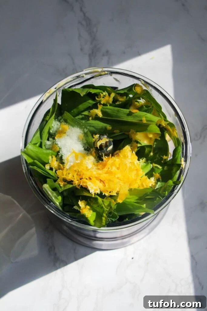 Ingredients for wild garlic butter in a small food processor.