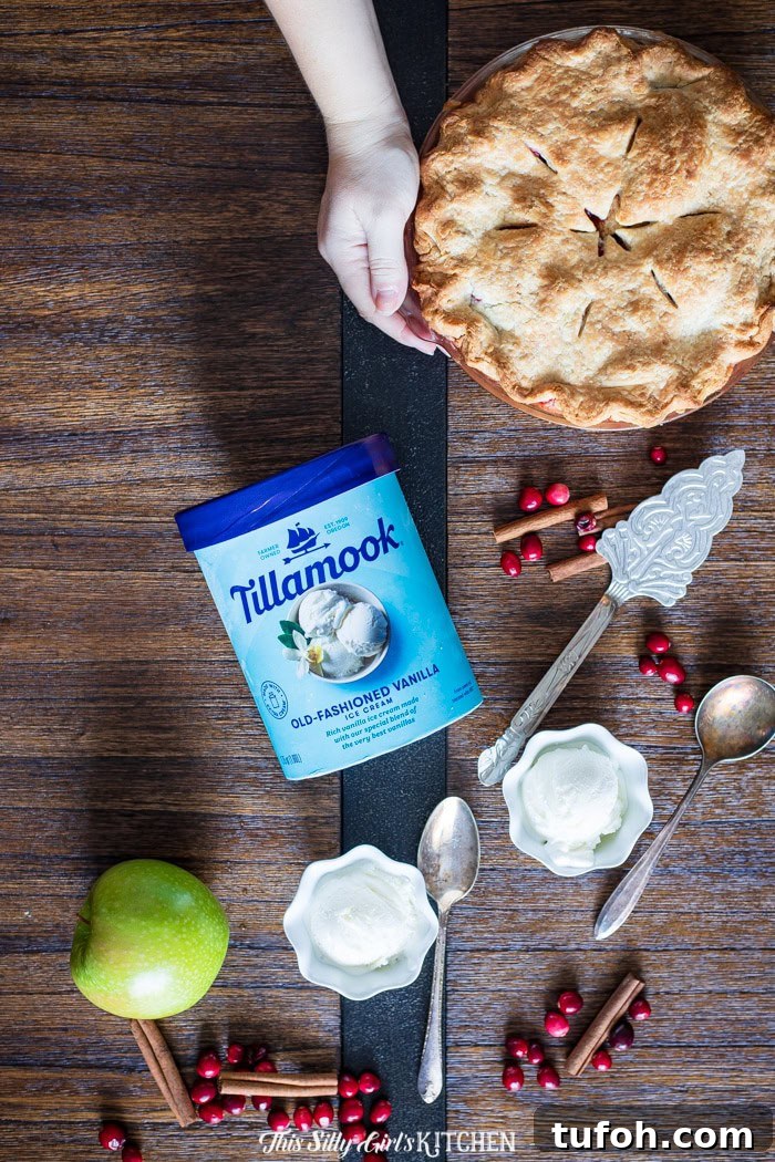 Apple Cranberry Pie, a homemade double pie crust pie stuffed with cinnamon-spiced apples and cranberries.