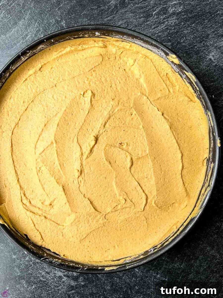 No-Bake Pumpkin Cheesecake Recipe — Creamy Fall Dessert 8 Spread the cheesecake filling on top of the cracker crumb crust.