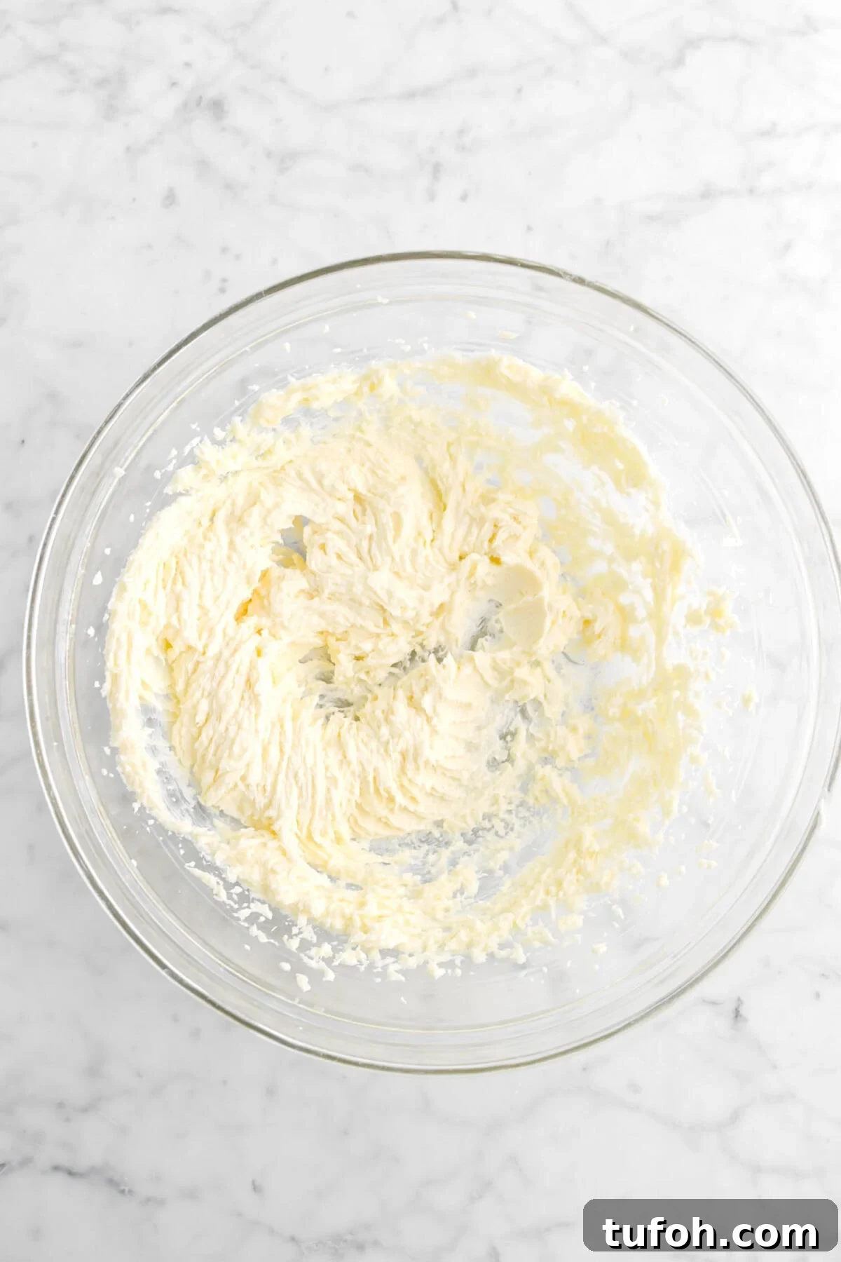 creamed butter and sugar in glass bowl