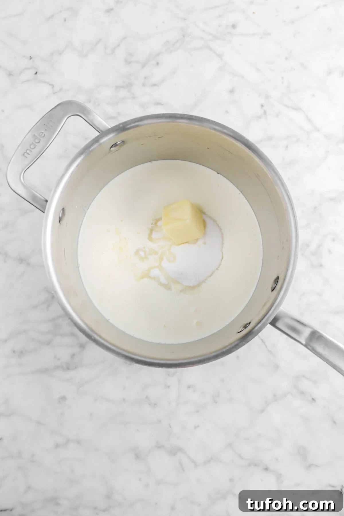 butter, heavy cream, sugar, and corn syrup in medium sized pot
