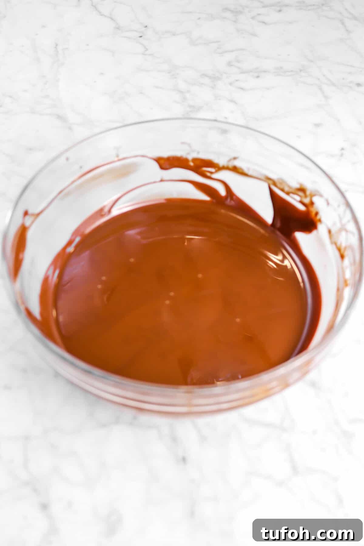 melted chocolate in glass bowl