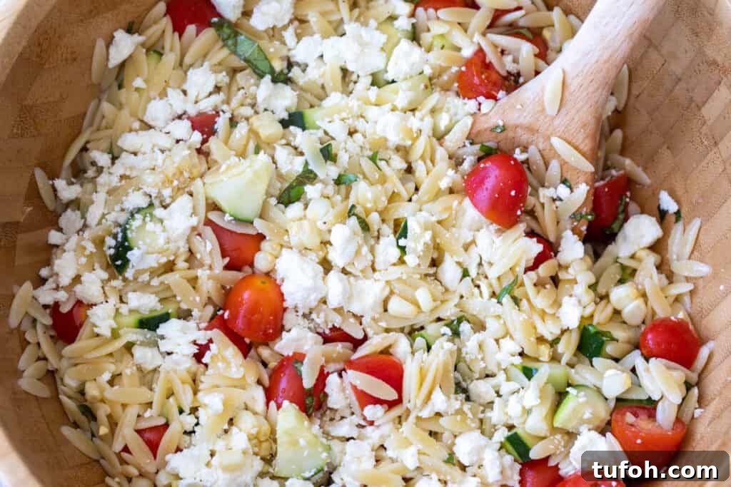 Summer Orzo (Risoni) Salad with Lemon & Fresh Herbs 8 closeup of summer orzo salad with cucumbers, tomato, corn, and feta
