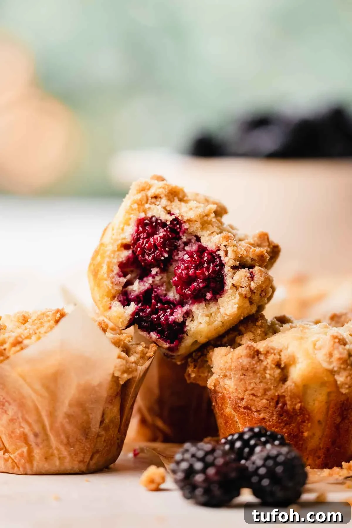 Irresistible Blackberry Muffin Recipe for Perfect Homemade Muffins 2 bitten buttermilk muffin studded with blackberries