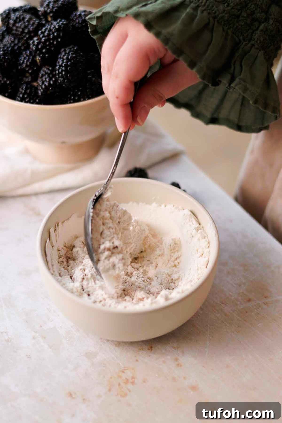 Irresistible Blackberry Muffin Recipe for Perfect Homemade Muffins 5 stirring flour and sugar together