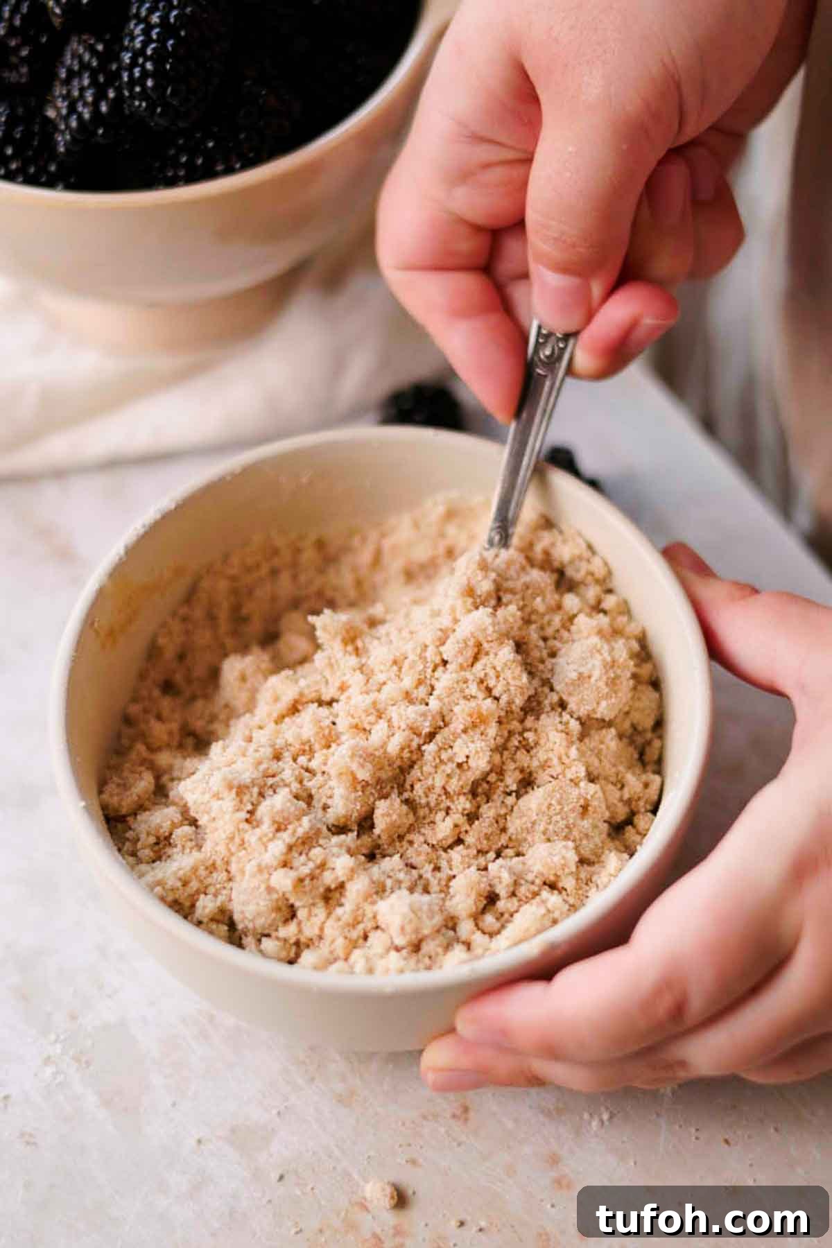 Irresistible Blackberry Muffin Recipe for Perfect Homemade Muffins 6 mixing crumble together in bowl