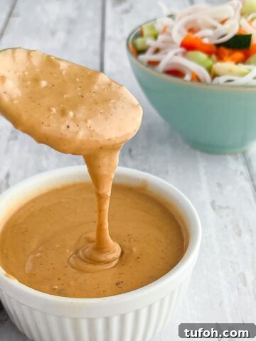 A spoonful of peanut sauce.