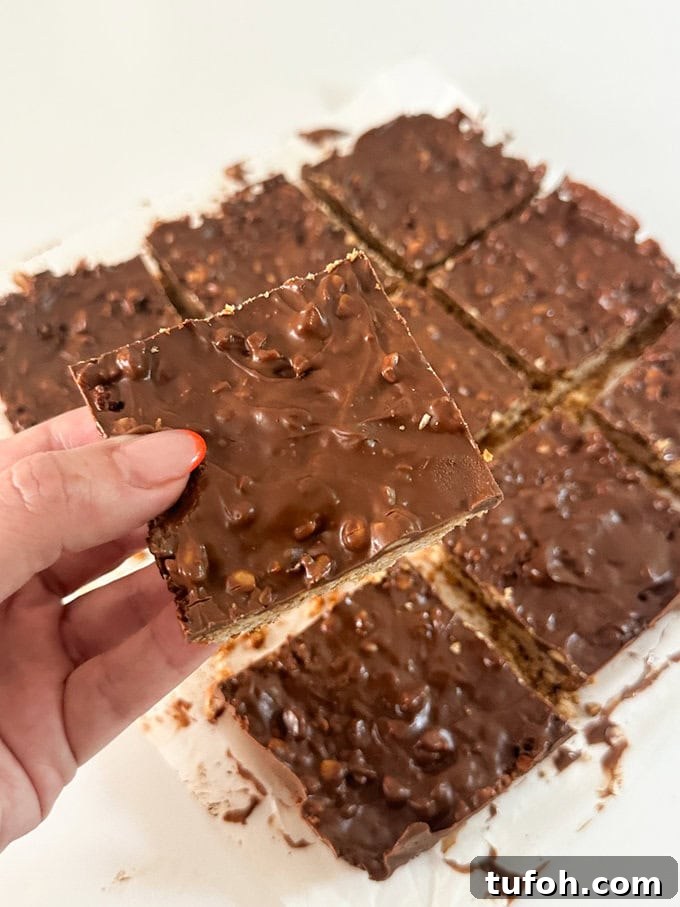 Peanut Butter Chocolate Flapjack Recipe — Chewy Oaty Bars 3 Close up of a square chunk of Peanut Butter Chocolate Flapjacks.