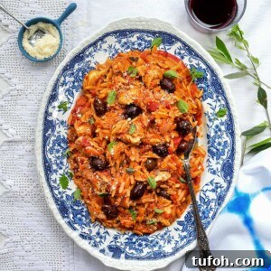 Slow Cooker Greek Chicken with Lemon-Orzo Recipe 8 Greek chicken and orzo pasta on a blue platter