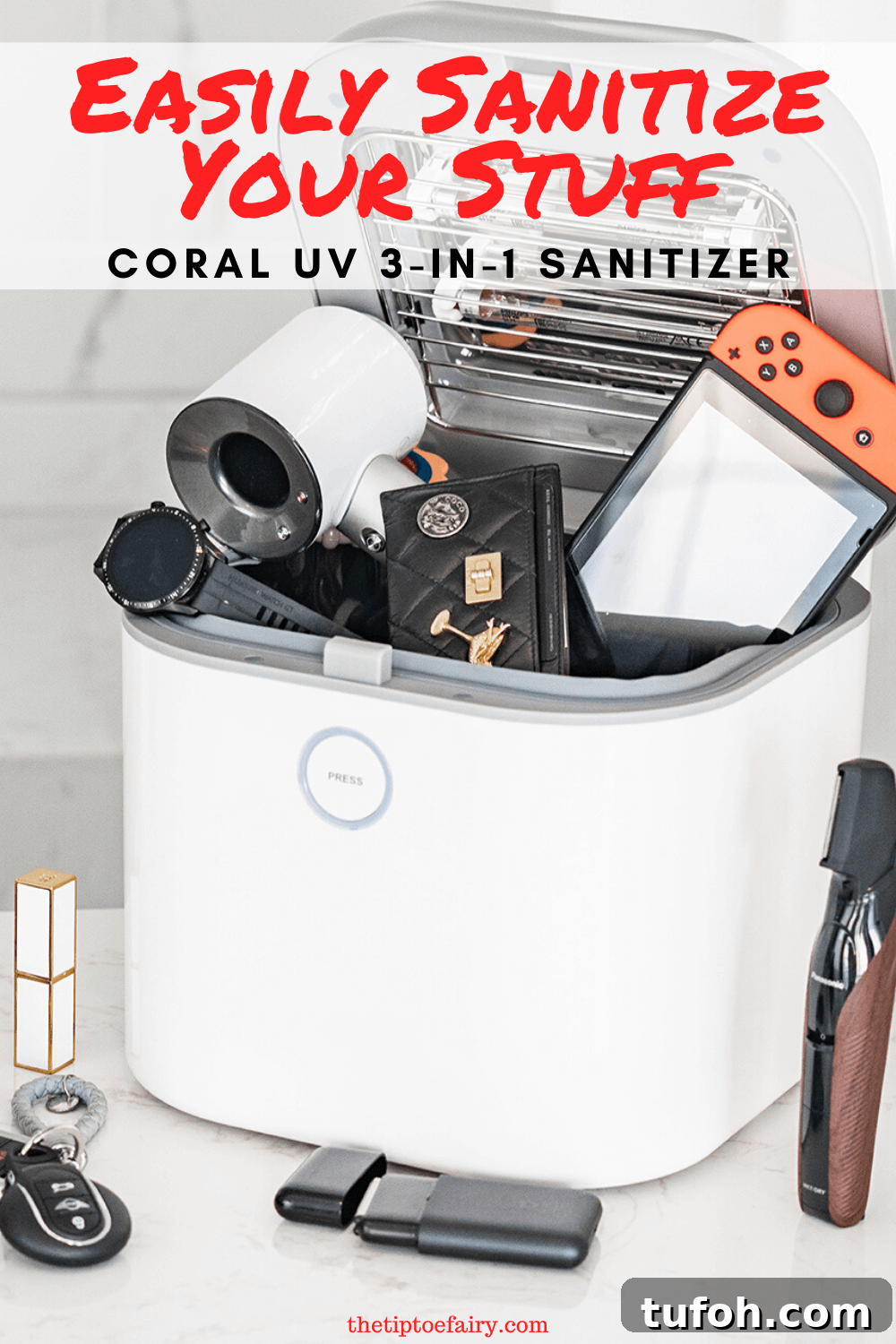 Sanitize and Sterilize Your Belongings Safely and Effectively 2 The open sanitizer with various electronic products like a Nintendo Switch, wrist watch, hair dryer, and more in it.