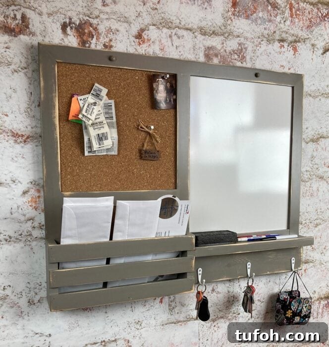 Create a Home Command Center: 18 Stylish Layout Ideas 11 gray wall organizer with cork board and dry erase side for family command center ideas