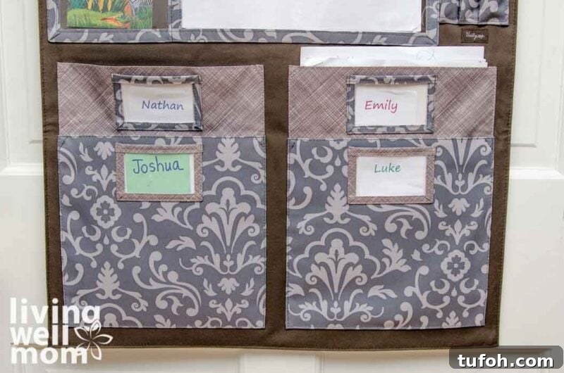 Create a Home Command Center: 18 Stylish Layout Ideas 8 four fabric file holders with kids names labeled on each