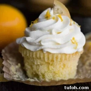 Tangy Lemon Cupcakes with Zesty Citrus Frosting 2 lemon cupakes with mascarpone frosting