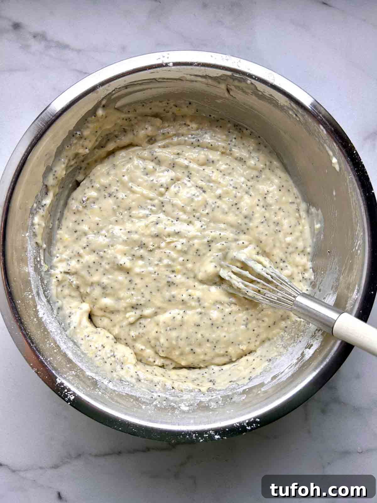 Lemon Poppy Seed Muffins Recipe: Moist, Zesty Muffins in 30 Minutes 6 batter whisked together in bowl.