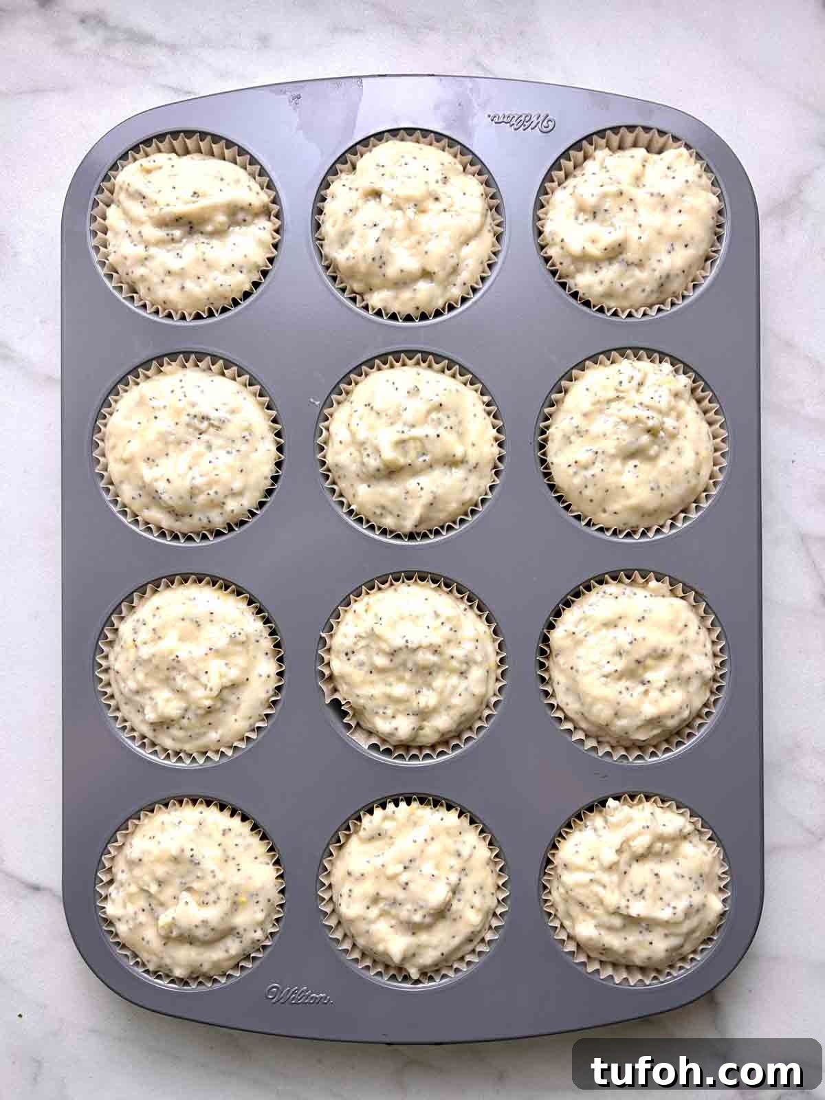 Lemon Poppy Seed Muffins Recipe: Moist, Zesty Muffins in 30 Minutes 7 batter scooped into muffin liners.