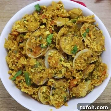 Goan clam sukka in a white bowl.