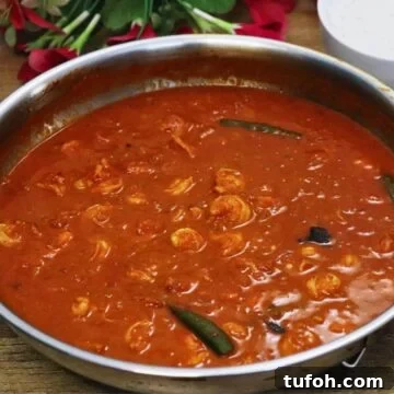 goan prawn ambot tik in a skillet.