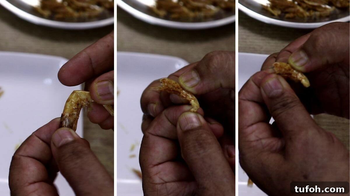 Removing head, tail, and legs from dry prawns.
