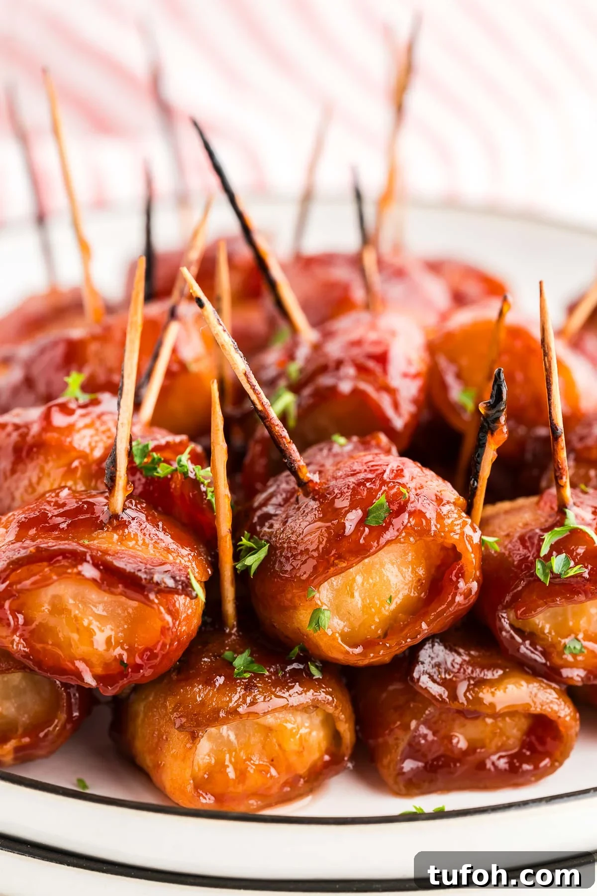 Crispy Bacon-Wrapped Water Chestnuts (Sweet & Savory Appetizer) 2 bacon wrapped water chestnuts appetizer on a plate