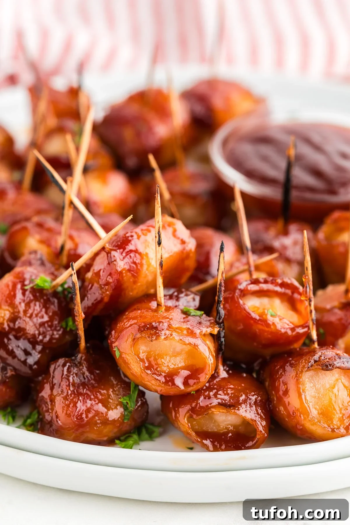 Crispy Bacon-Wrapped Water Chestnuts (Sweet & Savory Appetizer) 12 bacon wrapped water chestnuts appetizer on a plate