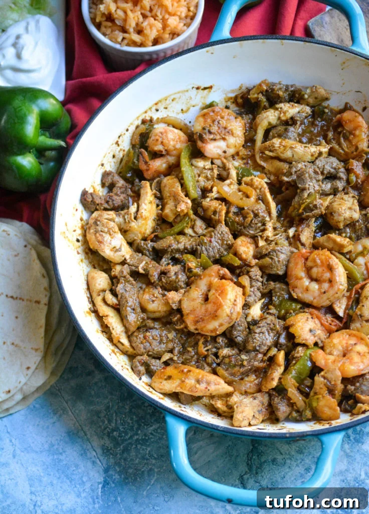 Texas fajitas filling shown in an enameled cast iron skillet