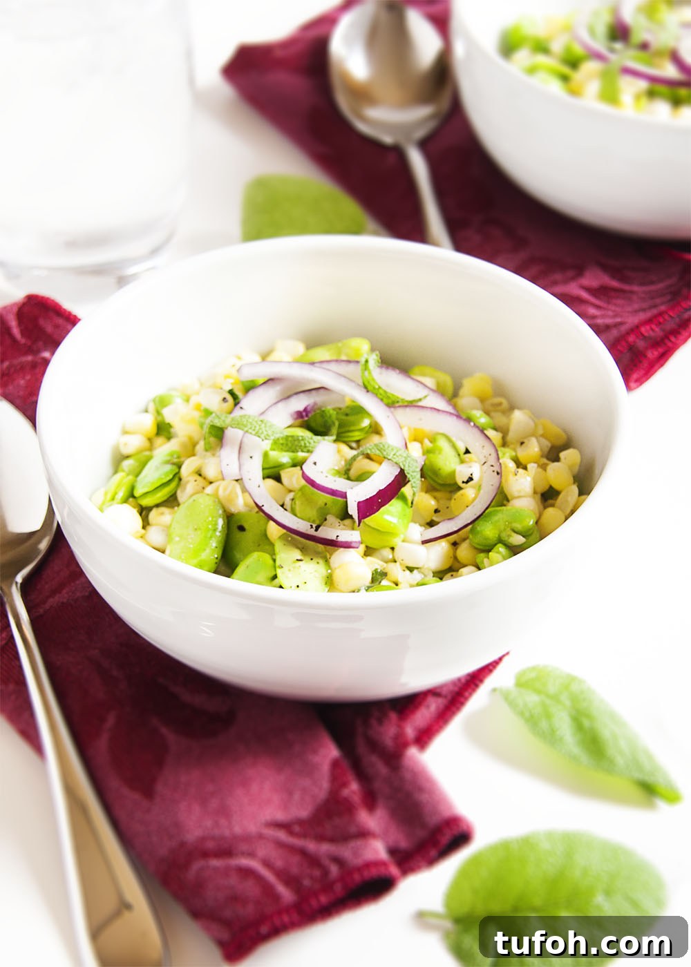 Summer Corn and Fava Bean Salad with Lemon Herb Dressing 2 Fresh Corn and Fava Bean Salad - This fresh and flavorful salad of corn and fava beans is a great way to take that tiny pile of fava beans which you extracted from a giant pile of bean pods and turn it into a satisfying side dish.