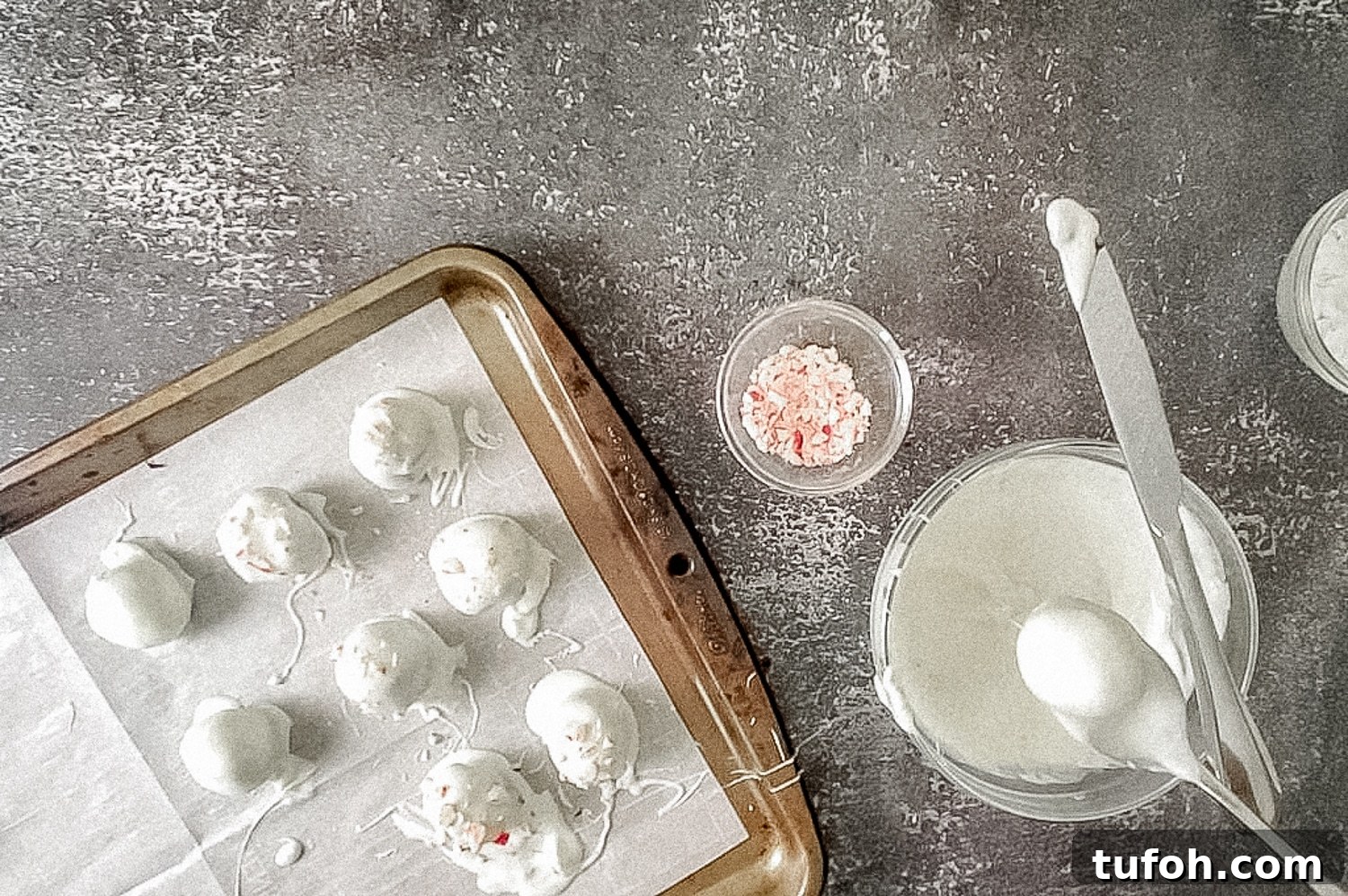 dipping Oreo balls in chocolate