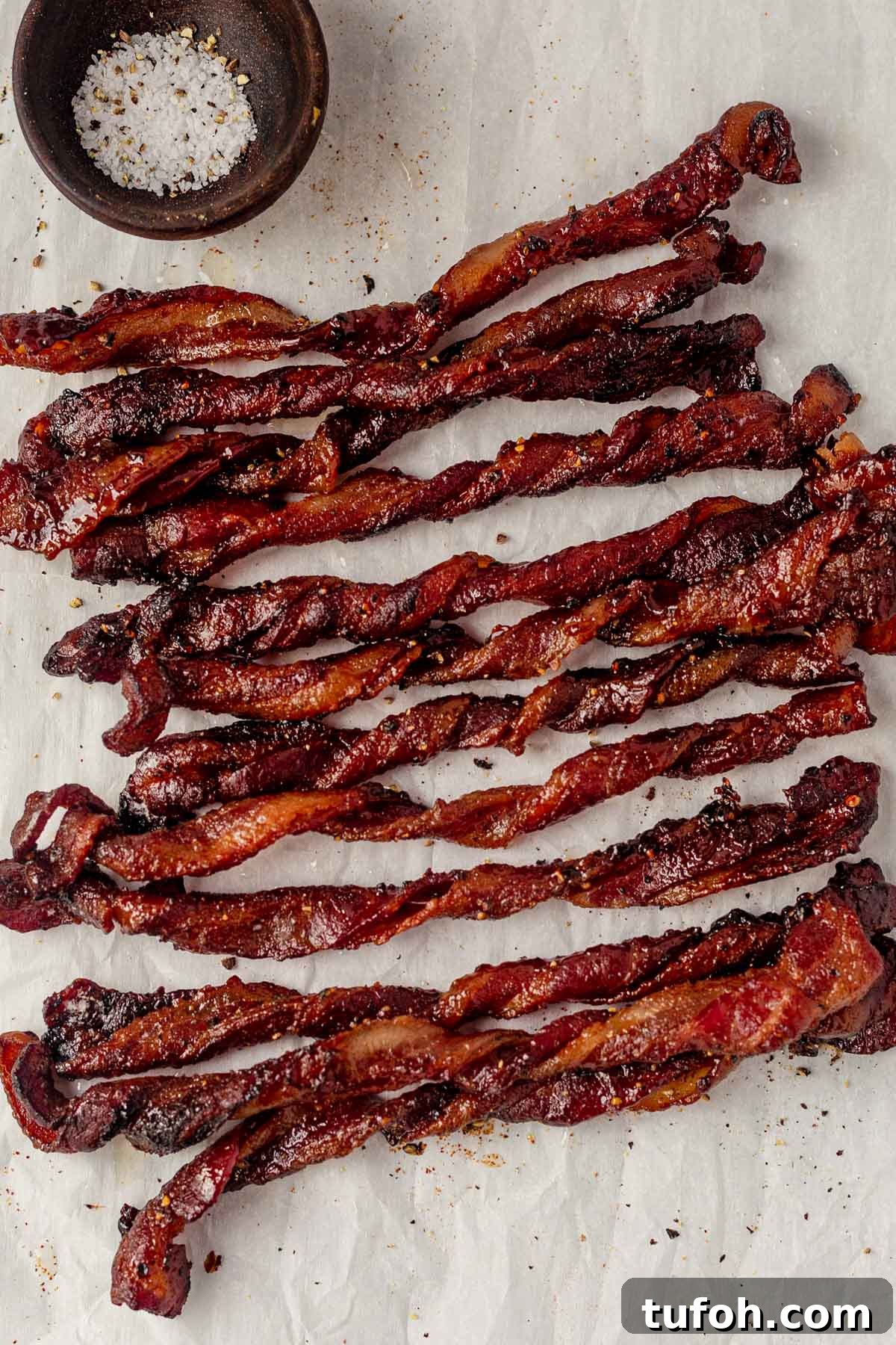 twisted bacon on parchment paper