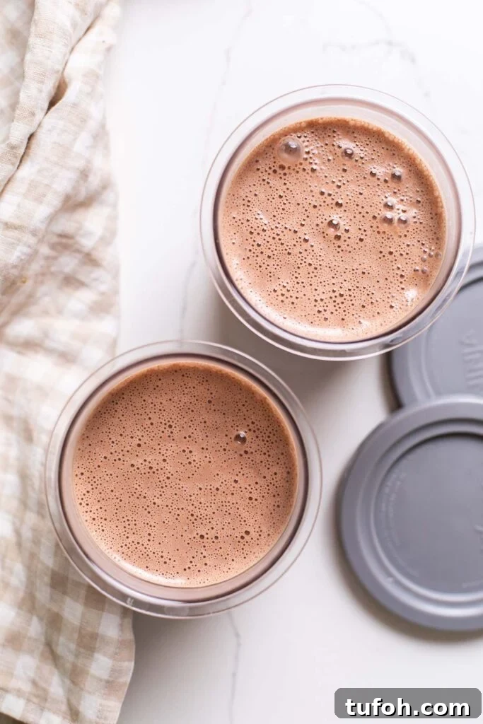 The ice cream base poured into the ninja creami pint containers.