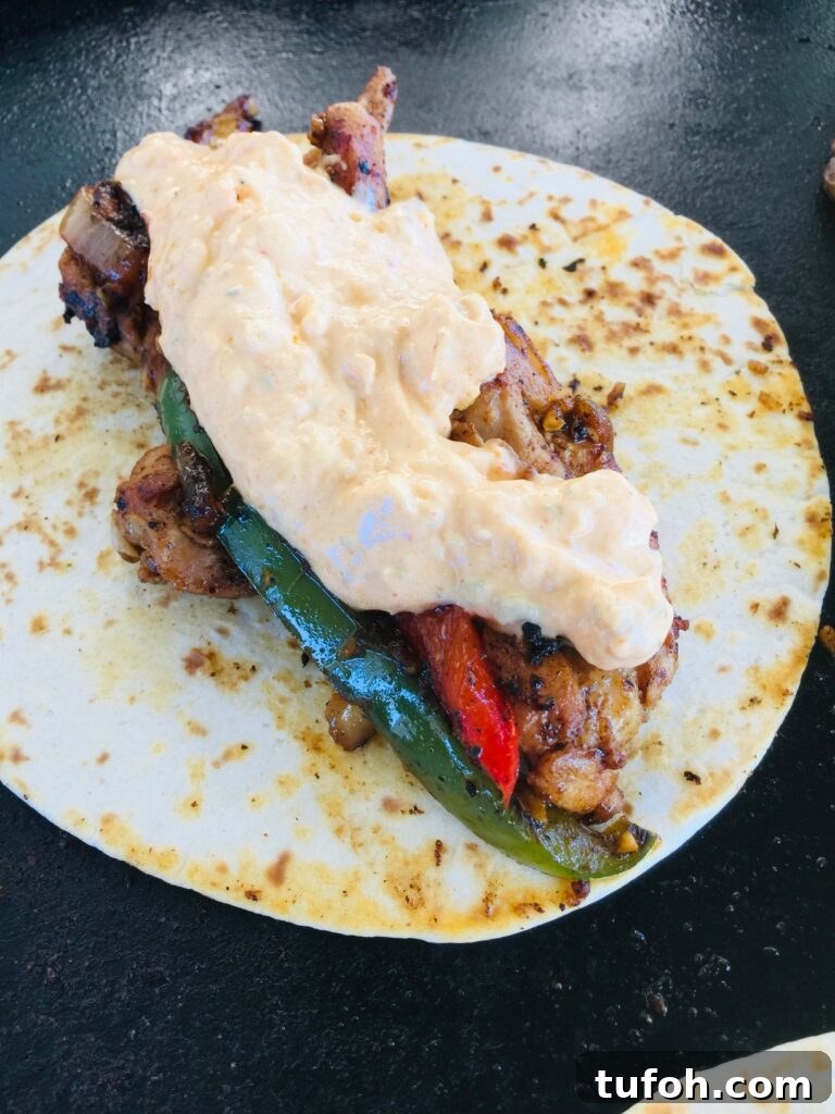 adding chicken and street corn for Blackstone Street Corn Chicken Fajitas
