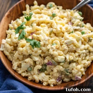 Creamy Tuna Macaroni Salad with Zesty Herb Dressing 7 Tuna macaroni salad in wooden bowl.