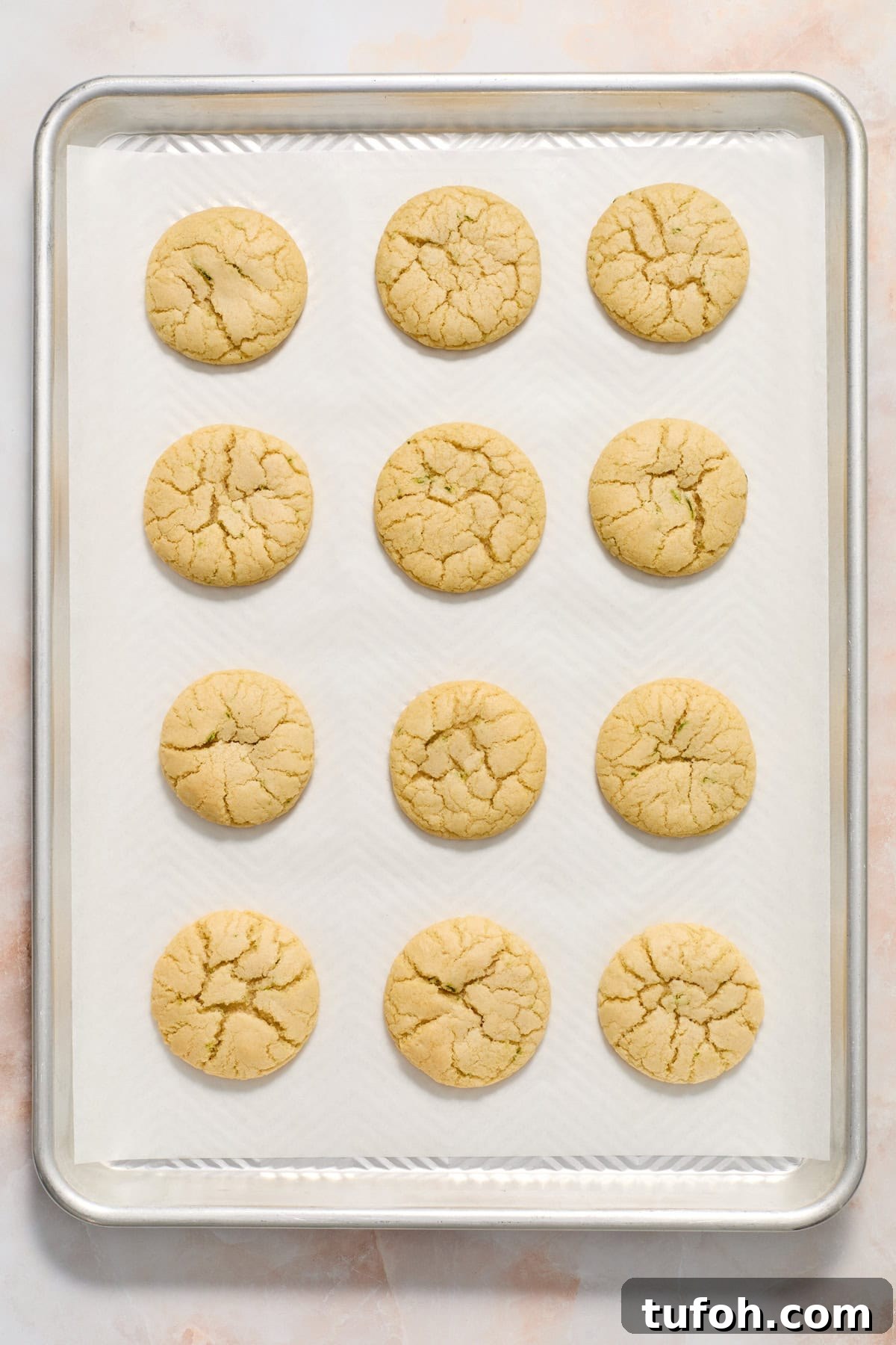 Lime sugar cookies after baking on sheet pan.