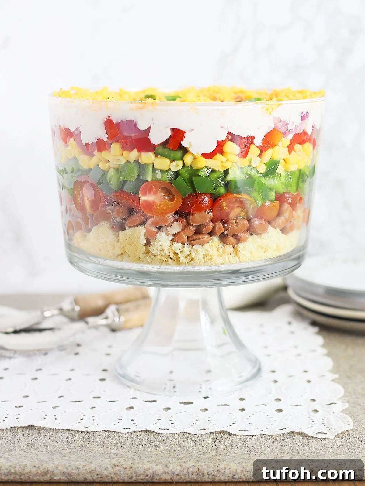 cornbread salad in a clear glass trifle bowl