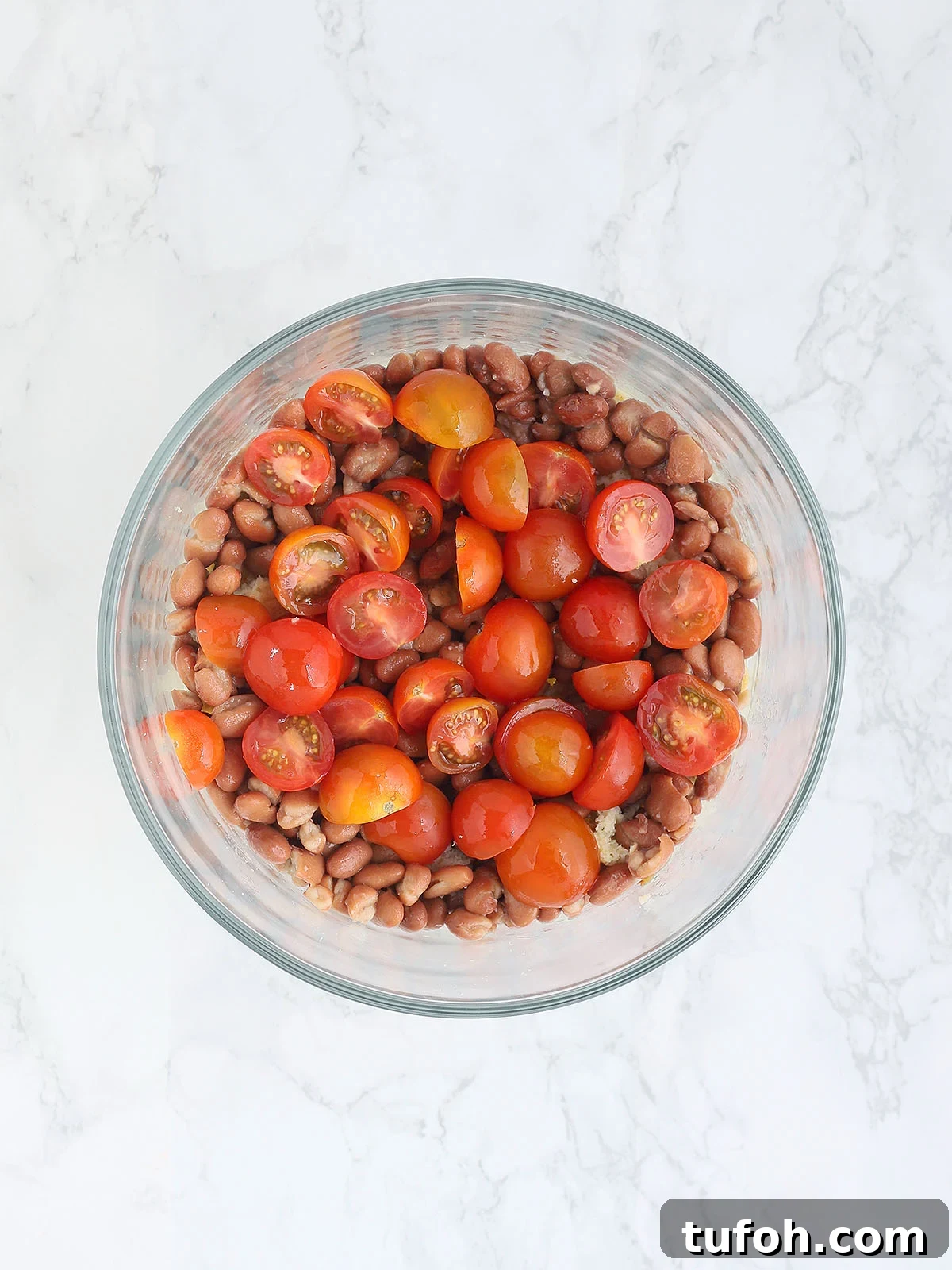 cornbread salad topped with juicy tomatoes