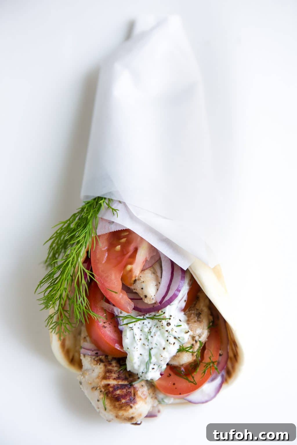 Yogurt Marinated Chicken Gyro with fresh cucumber Tzatziki Sauce wrapped in soft flatbread
