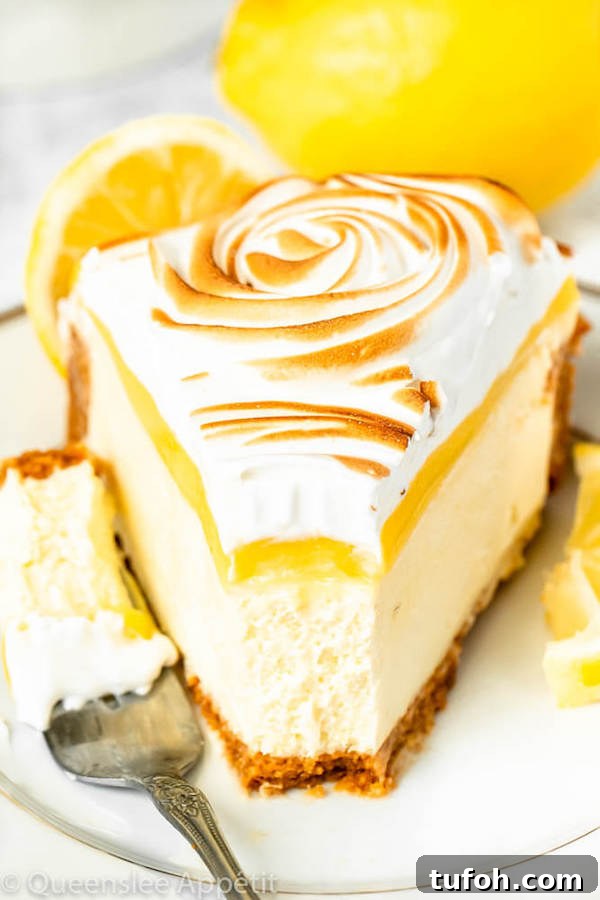 lemon meringue cheesecake with graham cracker crust, lemon cheesecake, lemon curd topping, meringue rosettes