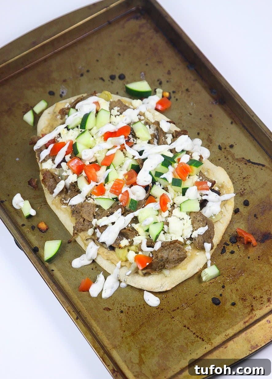 Baked Greek pizza with tzatziki