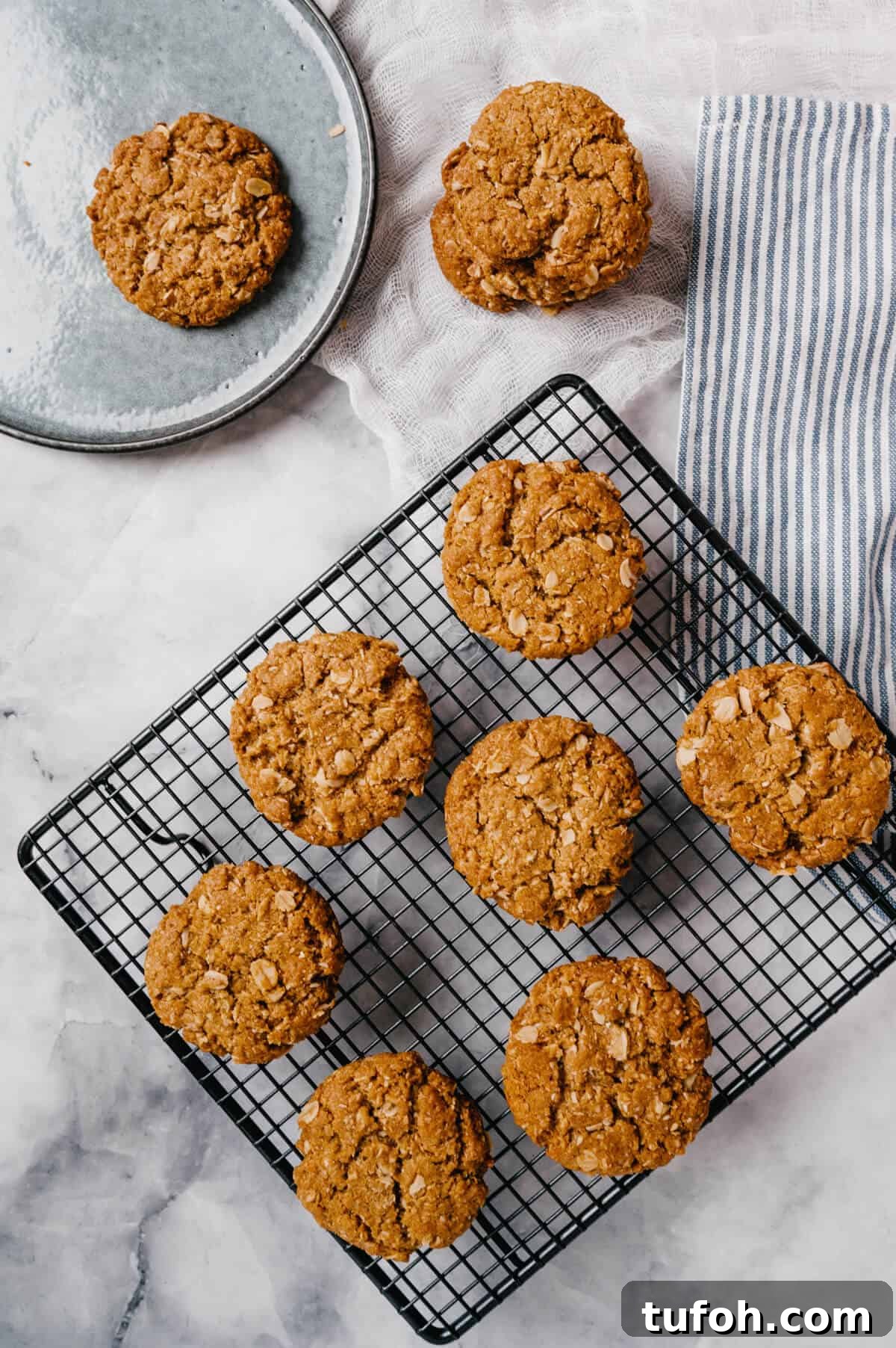 Anzac biscuits cooling on a wire rack.
