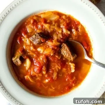Soup in bowl with spoon.