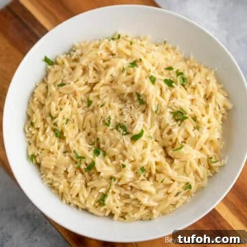 Creamy Orzo Pasta in a white bowl.