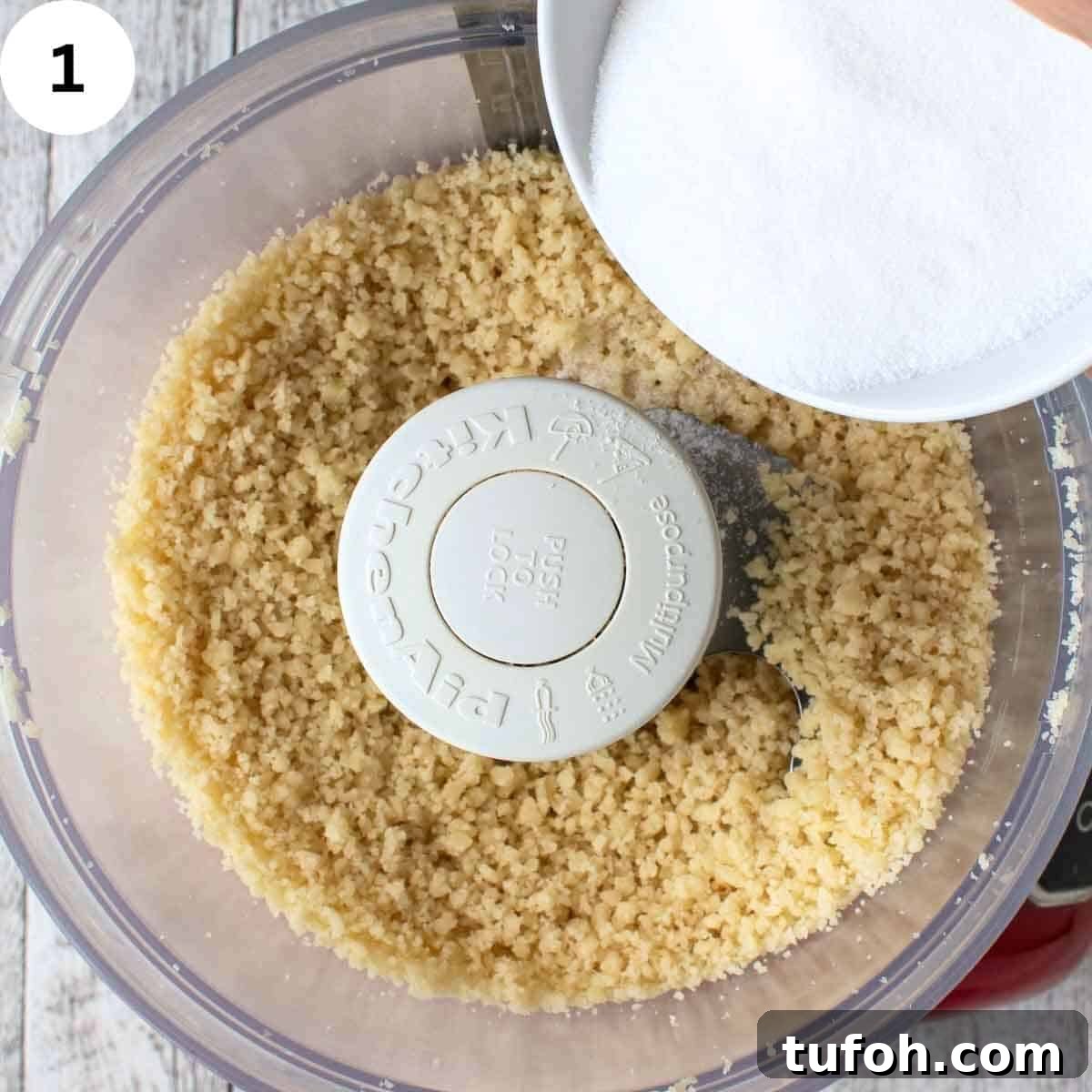 Pignoli Cookies: Classic Italian Almond Macaroon Recipe 4 Sugar being added to crumbly mixture in food processor.