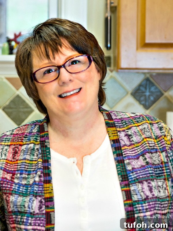 Irresistible Sausage Balls Recipe for Parties and Holidays 10 Head shot of Jennifer Field.