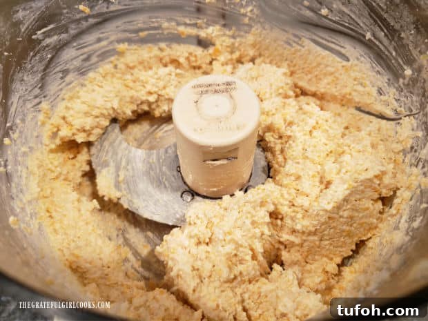 A food processor is used to process the cheese spread until smooth.