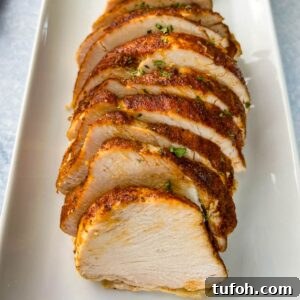 Crockpot Boneless Turkey Breast Recipe for Tender, Juicy Results 8 slow cooker Crockpot boneless turkey breast sliced on a white plate
