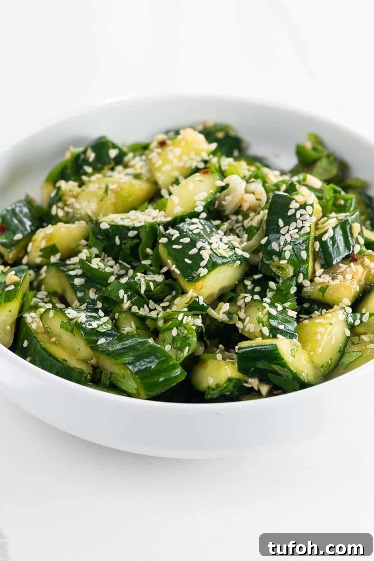 Crisp Smashed Cucumber Salad with Garlic and Sesame Dressing 5 smashed cucumber salad in a bowl