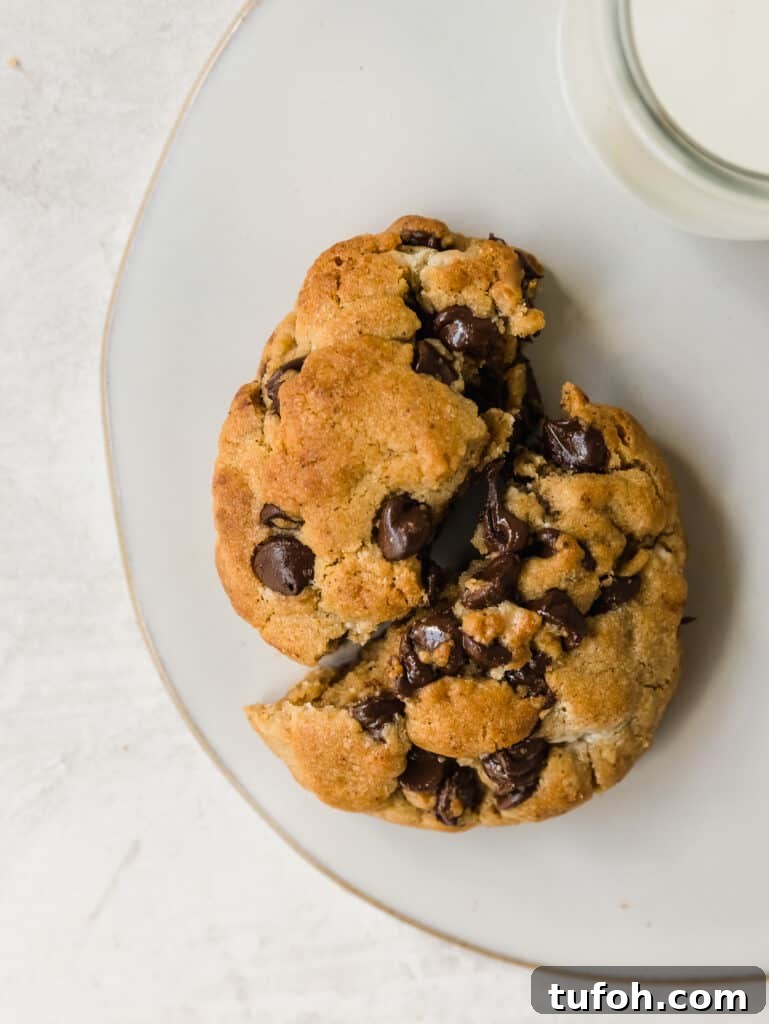 giant chocolate chip cookies made with tahini, brown butter, and halva. a fun twist on the classic inspired by levain bakery.