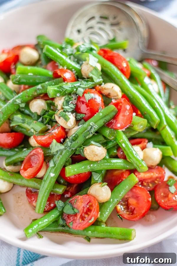 Green Bean and Tomato Salad | This colorful green bean and tomato salad can be served as a light meal or a side dish.